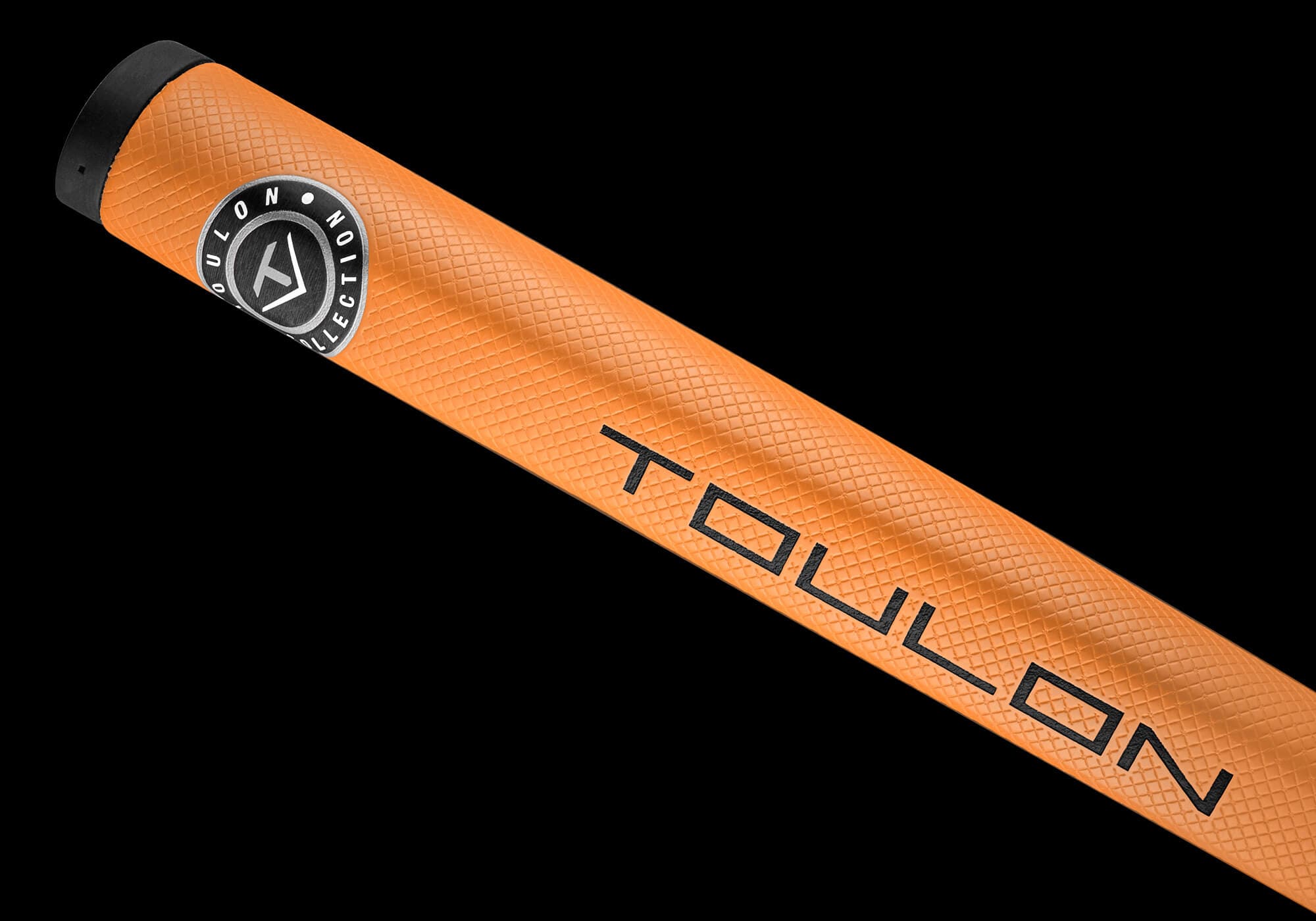 トゥーロン「Badlands」Small Batchパターの専用オレンジグリップ。「TOULON」ロゴ入りで、鮮やかなカラーとテクスチャーが際立つ。
